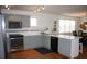 Eat-in kitchen with stainless steel appliances and light gray cabinets at 32 41St Ave, Isle of Palms, SC 29451