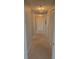 Hallway with carpet and doors to bedrooms and bathroom at 32 41St Ave, Isle of Palms, SC 29451