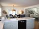 Open kitchen with white quartz countertops and light blue cabinets at 32 41St Ave, Isle of Palms, SC 29451