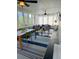Large screened porch with seating area and dining table at 32 41St Ave, Isle of Palms, SC 29451