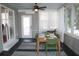 Dining area on the screened porch with access to the outdoors at 32 41St Ave, Isle of Palms, SC 29451