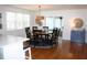 Round dining table with eight chairs, located next to the kitchen at 32 41St Ave, Isle of Palms, SC 29451