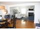 Bright dining room with wood floors and a round table that seats eight at 32 41St Ave, Isle of Palms, SC 29451