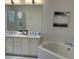 Bathroom with double vanity, shower, and bathtub at 32 41St Ave, Isle of Palms, SC 29451