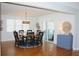 Round dining table with eight chairs and access to a screened porch at 32 41St Ave, Isle of Palms, SC 29451