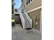 Exterior stairs leading to a deck with outdoor shower at 32 41St Ave, Isle of Palms, SC 29451
