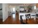 Open concept kitchen with island, stainless steel appliances, and hardwood floors at 32 41St Ave, Isle of Palms, SC 29451