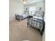 Serene bedroom with two twin beds, coastal-themed decor, and carpet at 32 41St Ave, Isle of Palms, SC 29451