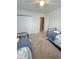 Bedroom with twin beds, carpet, and attached bathroom at 32 41St Ave, Isle of Palms, SC 29451