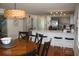 Dining room with wood table and chairs, and view of living room at 32 41St Ave, Isle of Palms, SC 29451