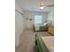 Charming bedroom with two twin beds, window, and ample closet space at 32 41St Ave, Isle of Palms, SC 29451