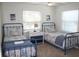 Charming bedroom with twin beds and beach decor at 32 41St Ave, Isle of Palms, SC 29451