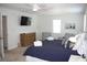 Main bedroom with king bed, two armchairs, and dresser at 32 41St Ave, Isle of Palms, SC 29451
