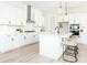 Modern white kitchen with stainless steel appliances and white cabinetry at 3531 Old Ferry Rd, Johns Island, SC 29455