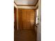 Wood paneled closet with louvered doors and hardwood floors at 617 Venning St, McClellanville, SC 29458