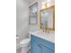 Charming bathroom with blue vanity, gold accents, and patterned tile shower at 517 Royall Ave, Mount Pleasant, SC 29464