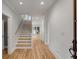 Spacious entryway with hardwood floors and staircase leading upstairs at 517 Royall Ave, Mount Pleasant, SC 29464
