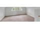Cozy attic bedroom with neutral carpet, an arched window, and ample natural light at 517 Royall Ave, Mount Pleasant, SC 29464