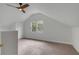 Bright attic bedroom featuring a ceiling fan and large window at 517 Royall Ave, Mount Pleasant, SC 29464