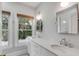 Double vanity bathroom with quartz countertops and updated fixtures at 517 Royall Ave, Mount Pleasant, SC 29464
