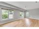 Spacious bedroom with hardwood floors, large windows, and ceiling fan at 517 Royall Ave, Mount Pleasant, SC 29464