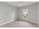 Charming bedroom with plush carpeting, large window, and neutral wall color at 517 Royall Ave, Mount Pleasant, SC 29464