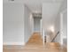 Bright hallway with light hardwood floors and access to multiple rooms at 517 Royall Ave, Mount Pleasant, SC 29464
