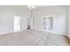 Bright and airy bedroom with carpet flooring and access to a sunroom at 1206 Creek Stone Way, Hanahan, SC 29410