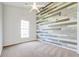 Bedroom with unique wood accent wall and carpet flooring at 1206 Creek Stone Way, Hanahan, SC 29410