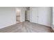 Bedroom with carpet, double doors to closet and ensuite bathroom at 1206 Creek Stone Way, Hanahan, SC 29410