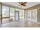 Bright screened porch with tile floor and access to backyard at 1206 Creek Stone Way, Hanahan, SC 29410
