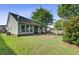 Large backyard with patio, landscaping, and privacy fence at 1206 Creek Stone Way, Hanahan, SC 29410