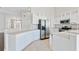 Modern kitchen featuring stainless steel appliances and white cabinetry at 1206 Creek Stone Way, Hanahan, SC 29410