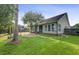Landscaped backyard with patio and mature trees at 1206 Creek Stone Way, Hanahan, SC 29410
