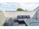 Private patio with fire pit and seating area, perfect for outdoor entertaining at 9 Iron Frg Aly, Charleston, SC 29403