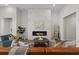 Living room with a stunning stone fireplace and hardwood floors at 619 Macintyre Cir, Summerville, SC 29486