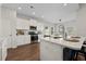 Modern kitchen with white cabinets, quartz countertops, and stainless steel appliances at 619 Macintyre Cir, Summerville, SC 29486