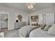 Main bedroom with king-size bed, dresser, and access to en-suite bathroom at 2006 Quiet Ibis Rd, Hanahan, SC 29410