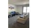 Living room featuring two sofas and large windows at 2150 Spoleto Ln # B-6, North Charleston, SC 29406