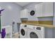 Convenient laundry room with washer, dryer, and ample counter space at 687 W Butternut Rd, Summerville, SC 29483