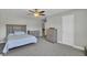 Bright bedroom with gray carpet, ceiling fan, and ample closet space at 687 W Butternut Rd, Summerville, SC 29483