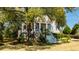 Two story home with large front porch and lush landscaping at 4233 Haulover Dr, Johns Island, SC 29455