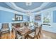Bright dining room with hardwood floors, wainscoting, and a crystal chandelier at 4233 Haulover Dr, Johns Island, SC 29455