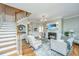 Open living room with hardwood floors, fireplace, and comfortable seating at 4233 Haulover Dr, Johns Island, SC 29455
