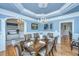 Elegant dining room with hardwood floors, a chandelier, and a large table at 4233 Haulover Dr, Johns Island, SC 29455