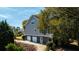 Rear view showing three car garage and landscaping at 4233 Haulover Dr, Johns Island, SC 29455