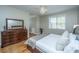 Bedroom with hardwood floors, large bed and dresser at 4233 Haulover Dr, Johns Island, SC 29455