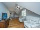 Versatile bonus room with hardwood floors, seating area, and home office at 4233 Haulover Dr, Johns Island, SC 29455