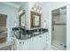 Elegant bathroom with double vanity, granite countertops, and a walk-in shower at 4233 Haulover Dr, Johns Island, SC 29455