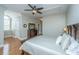 Bright bedroom with hardwood floors, a ceiling fan and large bed at 4233 Haulover Dr, Johns Island, SC 29455